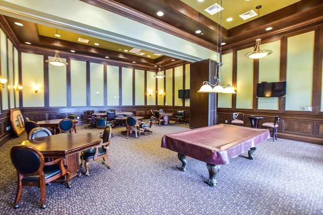 recreation room with visible vents, wainscoting, a decorative wall, and carpet