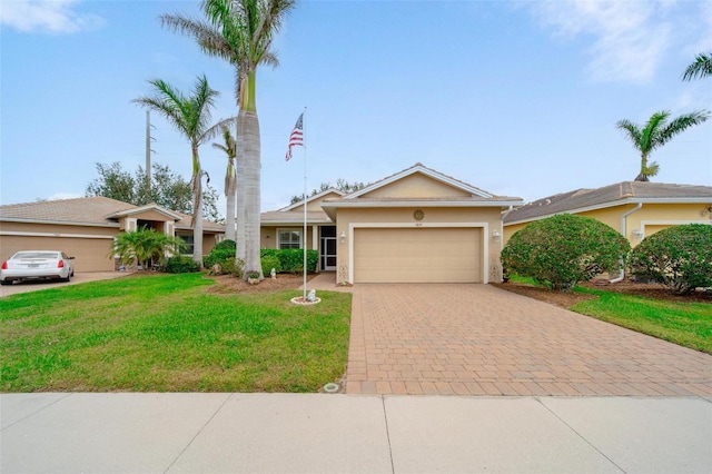 single story home with a garage, stucco siding, decorative driveway, and a front yard