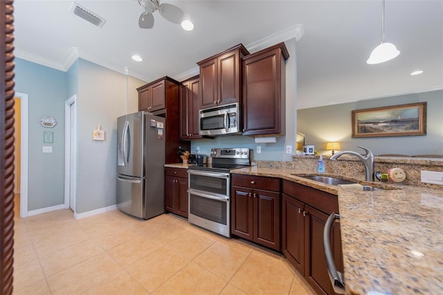 kitchen featuring light tile patterned flooring, stainless steel appliances, a sink, visible vents, and crown molding