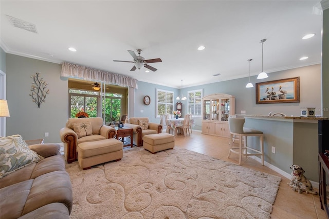 living area featuring light tile patterned floors, recessed lighting, visible vents, and crown molding