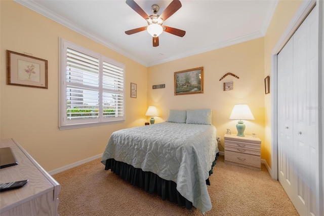 bedroom with baseboards, light colored carpet, ceiling fan, ornamental molding, and a closet