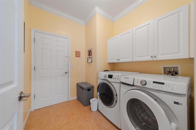 washroom with cabinet space, light tile patterned floors, baseboards, independent washer and dryer, and crown molding