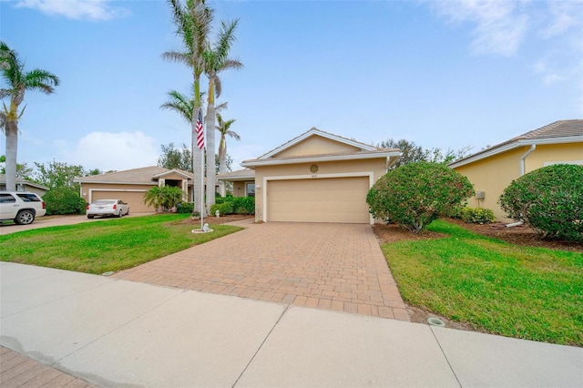 view of front of home featuring an attached garage, a front yard, decorative driveway, and stucco siding