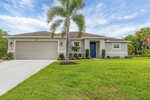 view of front facade featuring a garage, driveway, a front lawn, and stucco siding