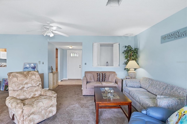 carpeted living area with ceiling fan