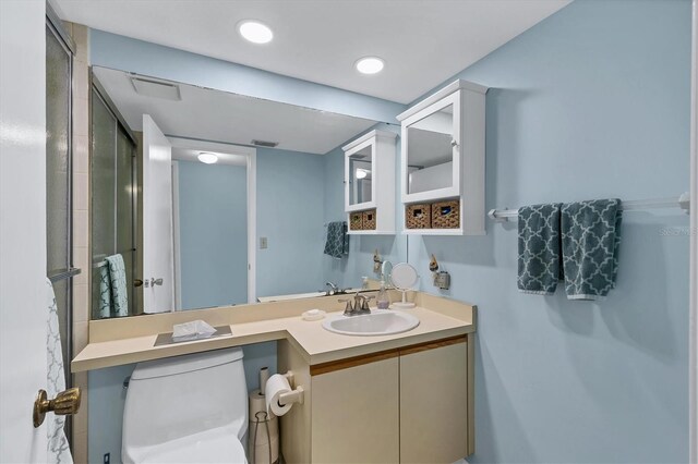 full bath featuring toilet, recessed lighting, visible vents, and vanity