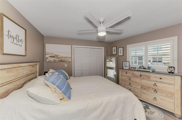 bedroom featuring a ceiling fan and a closet