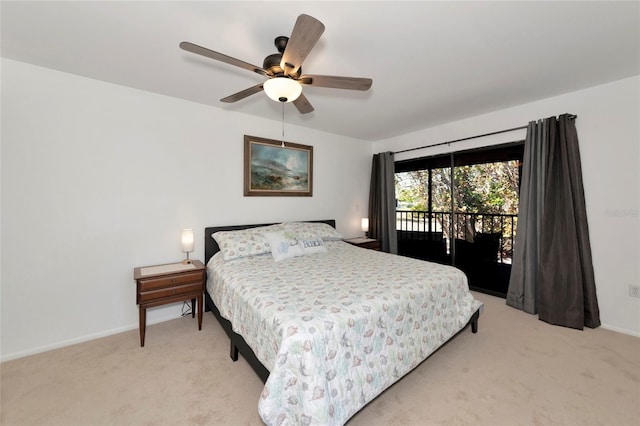 bedroom with access to exterior, light colored carpet, baseboards, and a ceiling fan