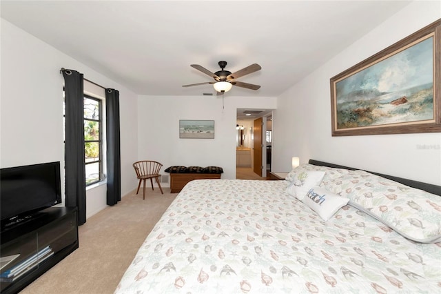 bedroom featuring light carpet and ceiling fan