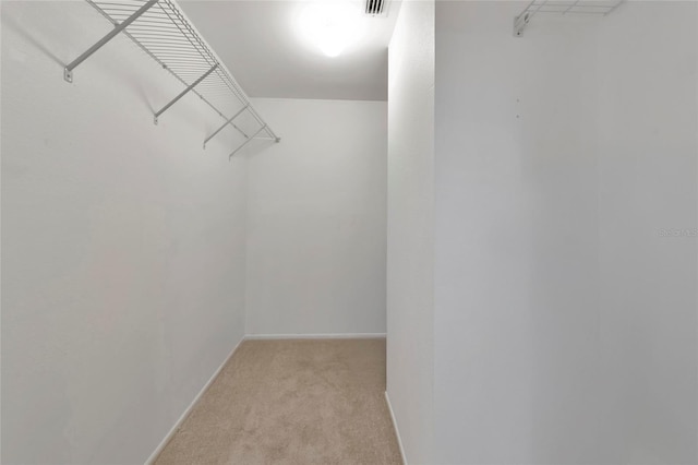 walk in closet with carpet floors and visible vents