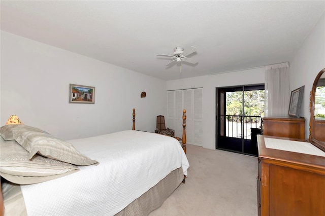 bedroom featuring access to exterior, a closet, light colored carpet, and ceiling fan