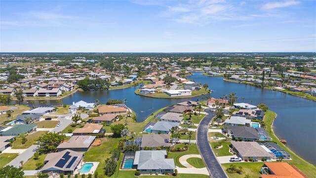 aerial view featuring a water view and a residential view