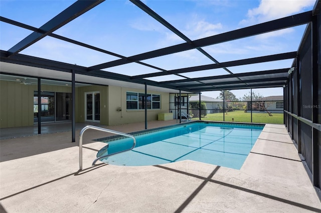 outdoor pool with a patio area and a lanai
