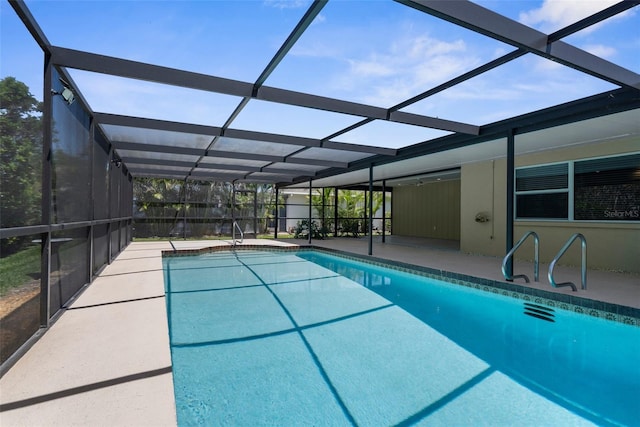 outdoor pool with a patio area and a lanai