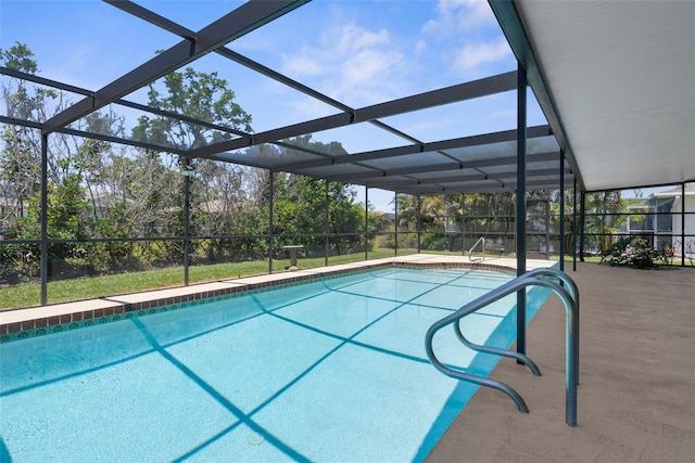 pool with a patio area and a lanai