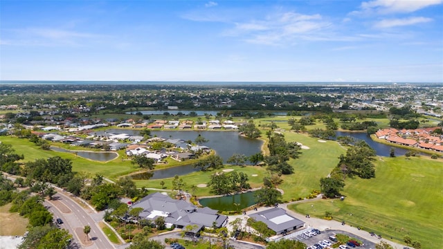 birds eye view of property with a water view, golf course view, and a residential view