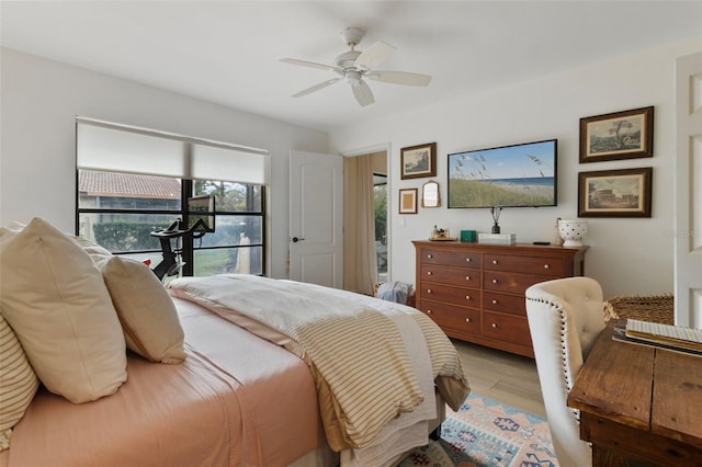 bedroom featuring wood finished floors and ceiling fan