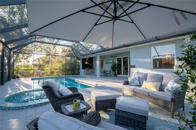 outdoor pool featuring glass enclosure, an outdoor living space, and a patio area