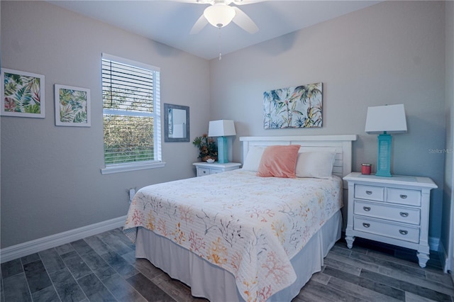 bedroom featuring dark wood finished floors, a ceiling fan, and baseboards