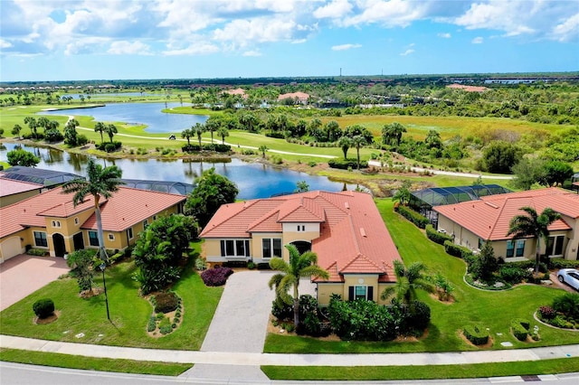 birds eye view of property featuring a water view and a residential view