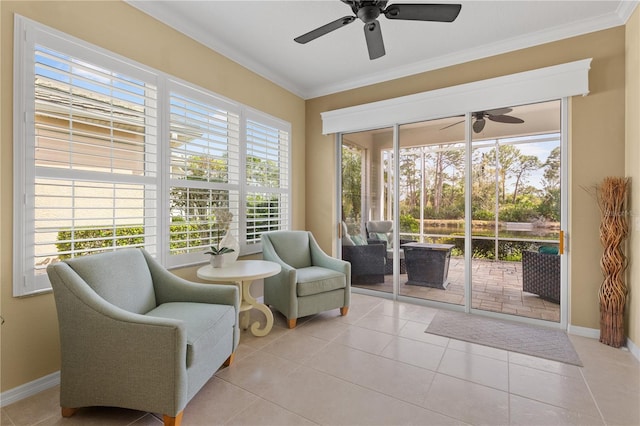 living area featuring ornamental molding, tile patterned floors, a sunroom, and baseboards