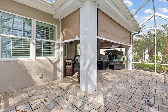 view of patio with a lanai