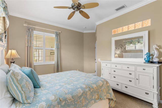 bedroom featuring ornamental molding, dark colored carpet, visible vents, and a ceiling fan