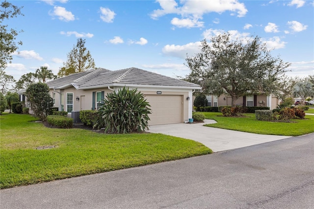 ranch-style home featuring a front lawn, a tile roof, driveway, and an attached garage