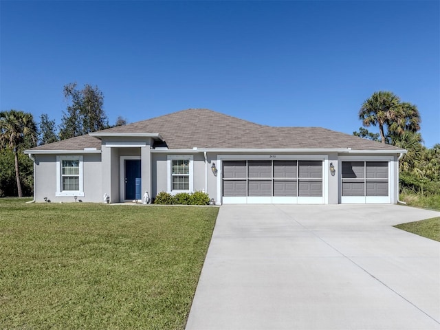 ranch-style home featuring stucco siding, driveway, an attached garage, and a front yard