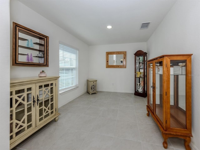 interior space with light tile patterned flooring, visible vents, recessed lighting, and baseboards