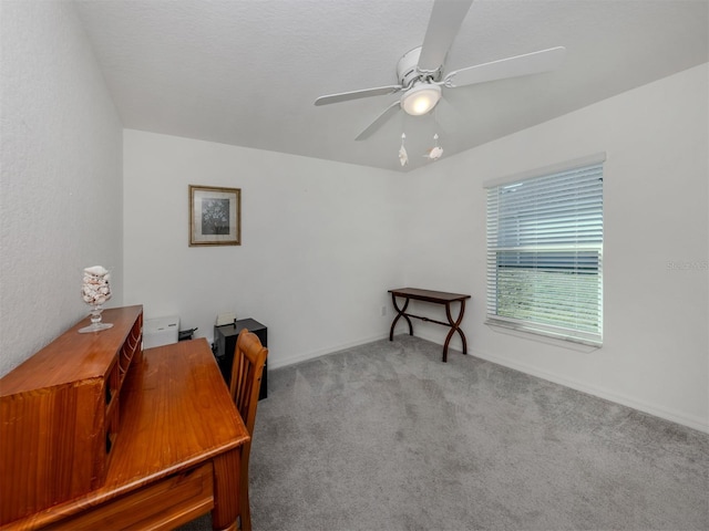 home office with a ceiling fan and carpet floors