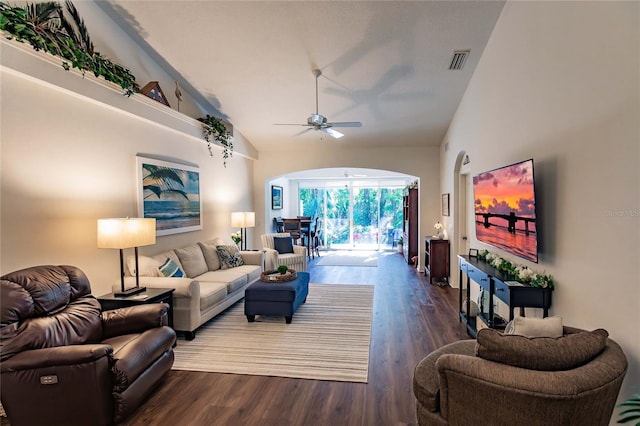 living area with high vaulted ceiling, wood finished floors, visible vents, and a ceiling fan