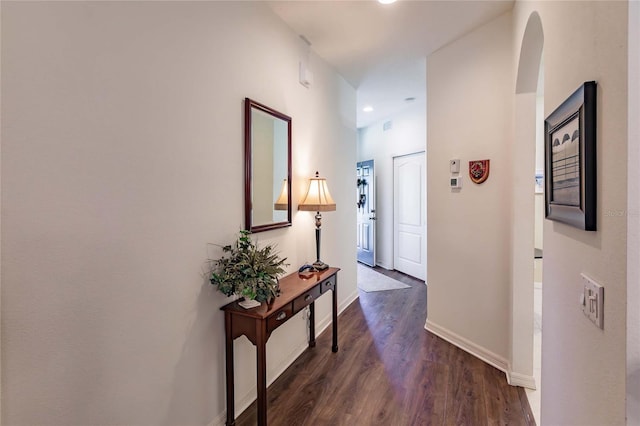 hall featuring dark wood finished floors and baseboards