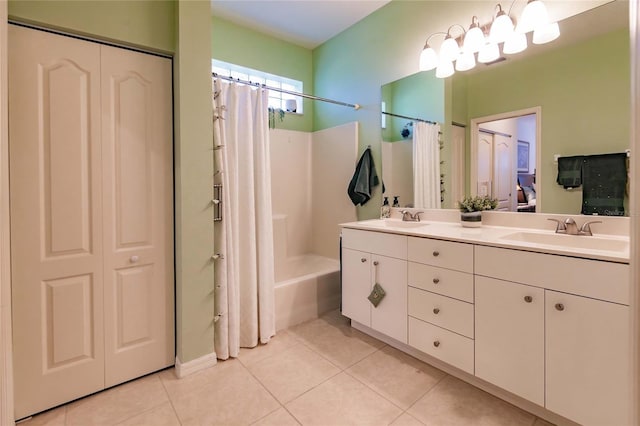 full bathroom with shower / bath combo, double vanity, tile patterned flooring, and a sink