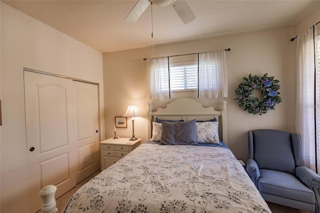 bedroom featuring ceiling fan and a closet