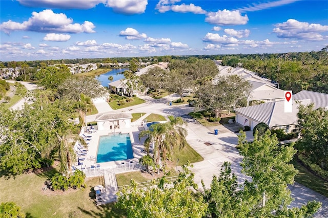 birds eye view of property with a water view