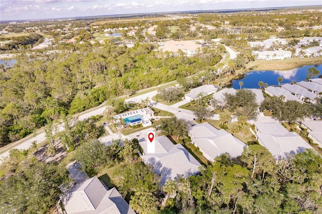 bird's eye view with a water view and a residential view