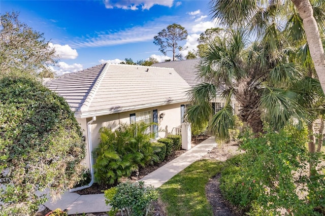 921 Tartan Dr Unit 31, Venice, FL 34293 - back of property with stucco siding and a tile roof