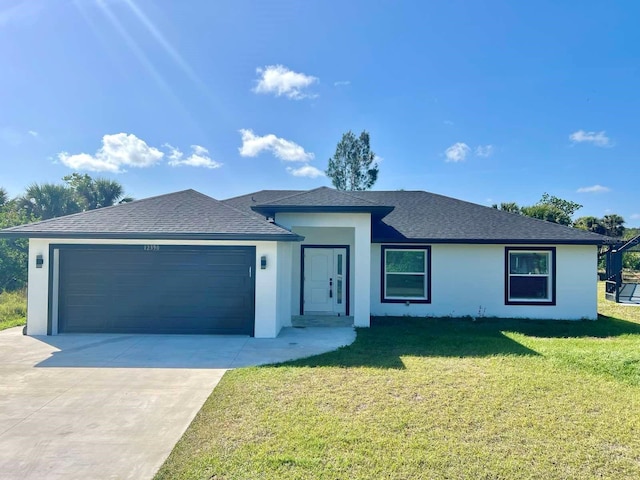 ranch-style home with stucco siding, a shingled roof, a garage, driveway, and a front lawn