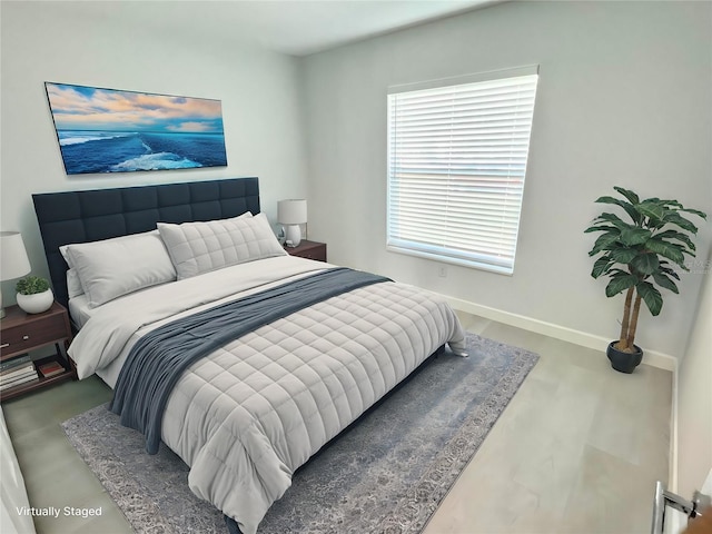 bedroom featuring baseboards