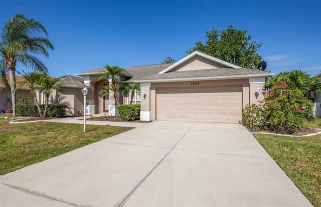 ranch-style house featuring an attached garage, a front yard, concrete driveway, and stucco siding