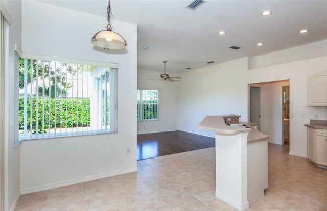 kitchen with recessed lighting, visible vents, a sink, and ceiling fan