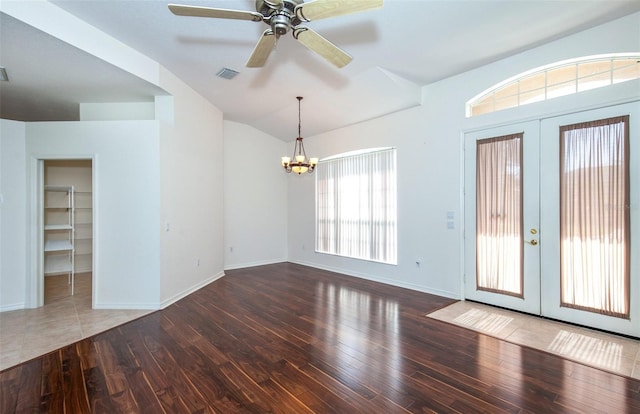 interior space featuring lofted ceiling, french doors, wood finished floors, and visible vents