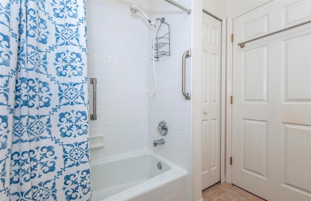 bathroom with shower / bath combo and tile patterned flooring