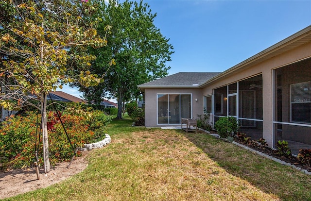 view of yard featuring a sunroom