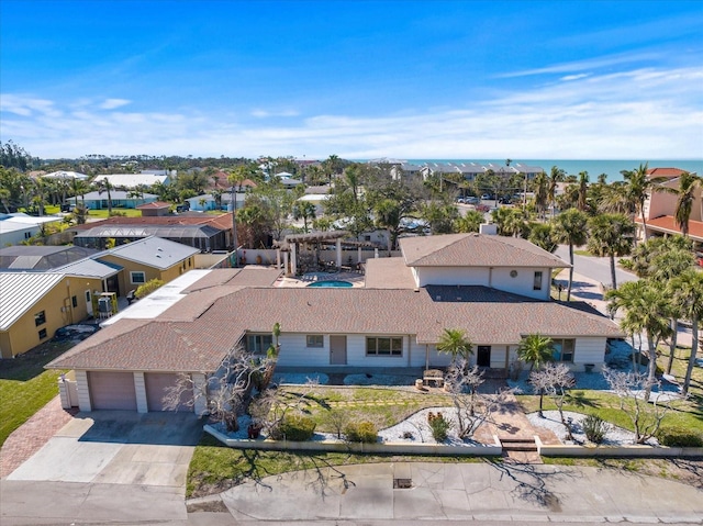 bird's eye view with a residential view and a water view