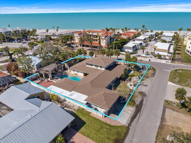 drone / aerial view with a residential view and a water view