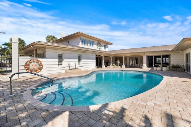 view of pool featuring a fenced in pool, a patio area, and fence