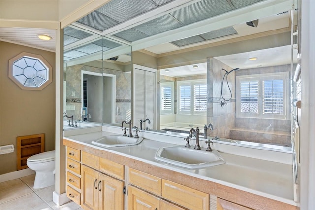 bathroom featuring tile patterned floors, walk in shower, toilet, a bath, and vanity