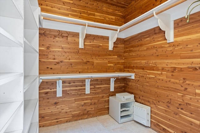 walk in closet with light tile patterned flooring